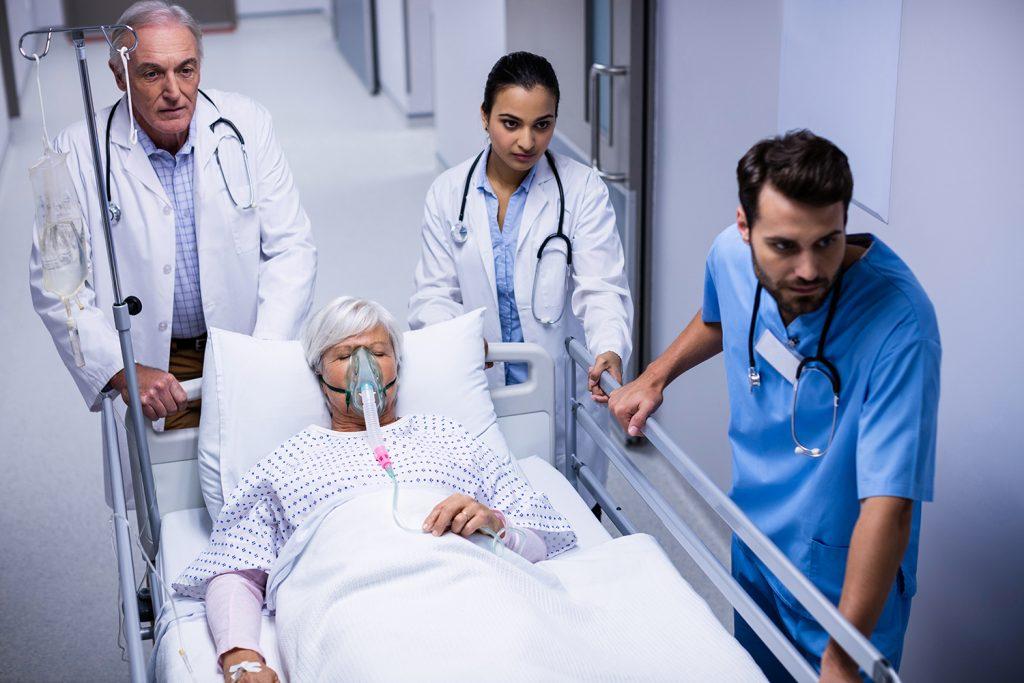 doctor-nurse-pushing-emergency-stretcher-bed-corridor-1024x683.jpg